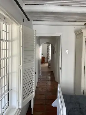a hallway in a house with white walls and an archway at 13 On Vigne in Greyton