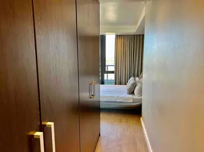 a room with a bed and a door leading to a bedroom at Grand Penthouse / Backup Power / Stunning in Cape Town
