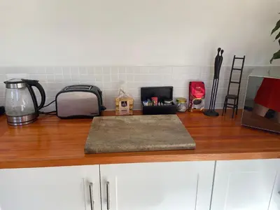 a kitchen counter with a counter top with items on it at 4 on Belmont Avenue in Somerset West