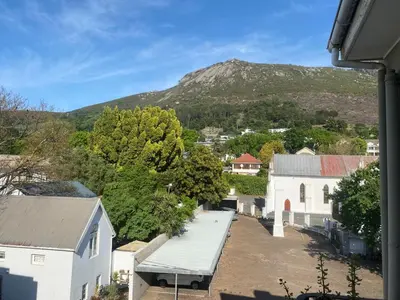 a view of a town with a mountain in the background at Pepper Korrel - Paarl - Self Catering Apartment in Paarl