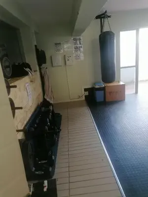 a room with a gym with a water tank at Beach Club 47 Hermanus in Hermanus