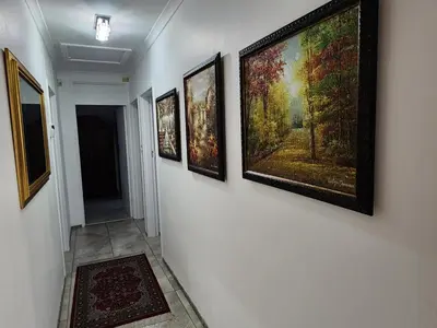 a hallway with four paintings on a wall at Cape Town gem 