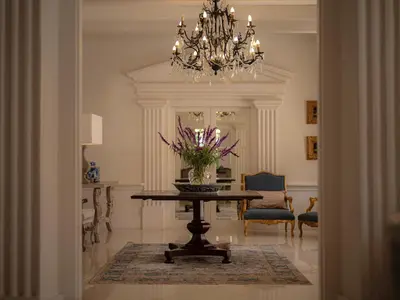 a dining room with a table and a chandelier at The Doolhof Country House in Wellington