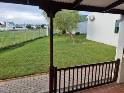 a view of a yard from a balcony at Strawberry fields Tranquility in Cape Town