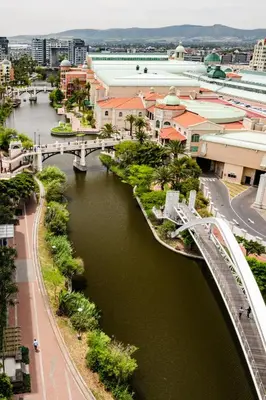 a bridge over a river in a city at Belina - Crystal Towers Presidential Penthouse in Cape Town