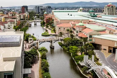 a city with a river and a bridge at Belina - Crystal Towers Presidential Penthouse in Cape Town
