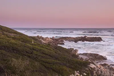 a view of the ocean from a hill at Casa Familia in Hermanus