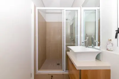 a bathroom with a shower and a sink at Horizon Bay 1603 by HMH in Cape Town