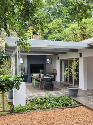 an outdoor patio with a table and chairs at Newly Renovated - Stellenbosch Farm Cottage in Stellenbosch