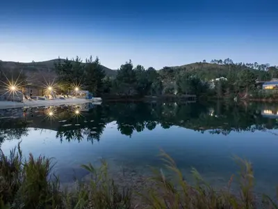 a view of a lake at night at Old Mac Daddy in Botrivier
