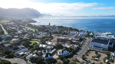 an aerial view of a city and the ocean at 2 Barford Haven in Hermanus