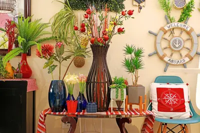 a table with vases and plants on a wall at Horizon Bay 1201 in Bloubergstrand