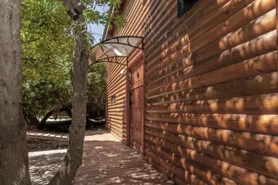 a brick wall with a lamp next to a building at The Blue Cabin in Fisherhaven