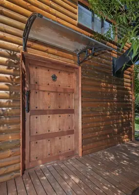 a wooden garage door on a wooden house at The Blue Cabin in Fisherhaven