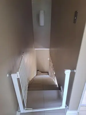 a staircase in a building with a stair case at Pearlmar Views in Cape Town