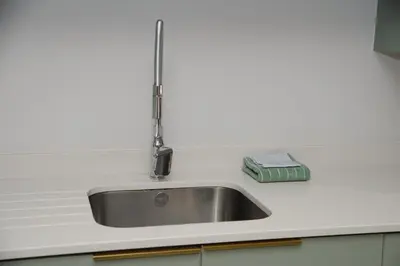 a kitchen sink with a faucet on a counter at Oranje Meul in Paarl