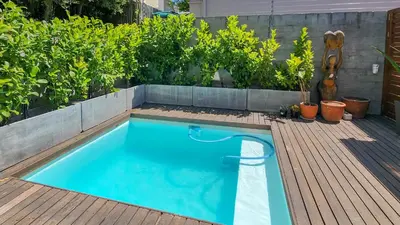 a small swimming pool in a garden with plants at House of Anjel in Suider-Paarl