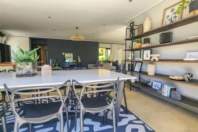 a dining room with a table and chairs at House of Anjel in Suider-Paarl
