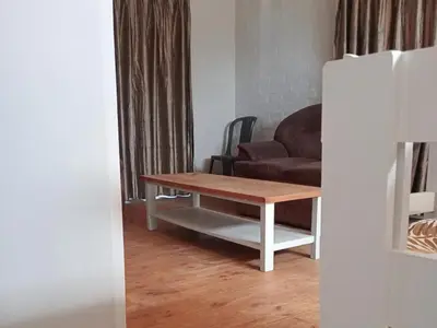 a living room with a coffee table and a couch at Gizelle in Cape Town