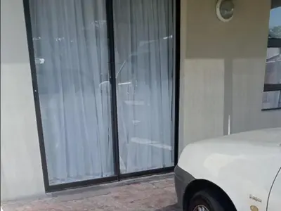 a room with sliding glass doors in a house at Gizelle in Cape Town