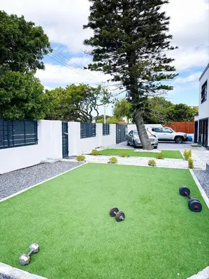a artificial lawn with rocks on top of it at Urban Cosy City Haven in Cape Town