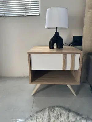 a lamp on a dresser with a lamp on it at Urban Cosy City Haven in Cape Town
