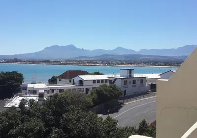 a view of a city and a body of water at First Group Cape Gordonia in Gordonʼs Bay