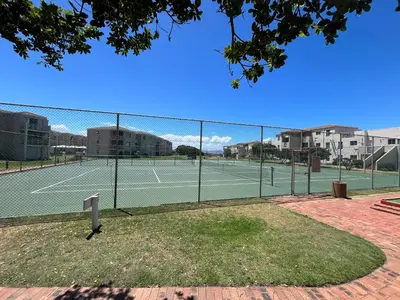 a tennis court with two tennis courts at #One6Eight in Hermanus