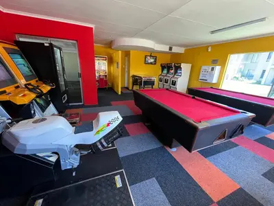 a room with a pool table and a video game at #One6Eight in Hermanus