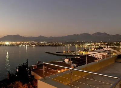 a view of a body of water at night at Bayview in Gordonʼs Bay