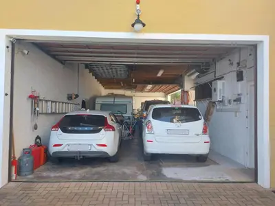 two cars are parked in a garage at The Waves of Schulphoek in Hermanus