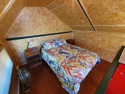 an overhead view of a bed in a small room at The Red Fox in Cape Town