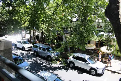 a group of cars parked in a parking lot at Contemporary Central Apartment by ARPA Hospitalities in Stellenbosch
