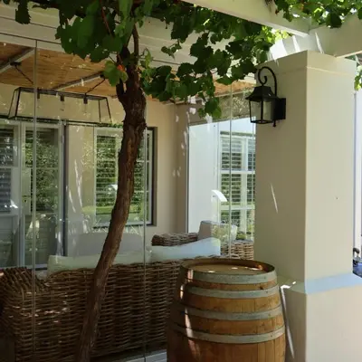 a room with a tree and a barrel at Kleinhof in Franschhoek