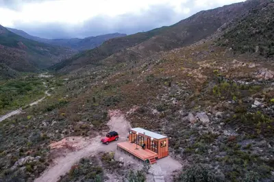 an aerial view of a tiny house on a mountain at Luxury Solace Cabin - River Cabin in Rawsonville