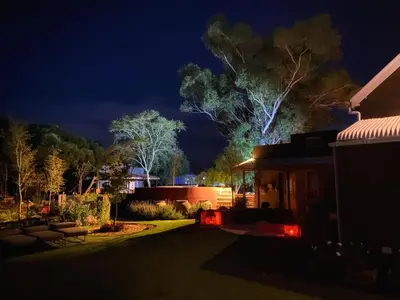 a night view of a house with a tree at De Dapper Huys in Philadelphia