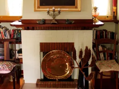 a brick fireplace with a plate in front of it at Linge Longa in Worcester