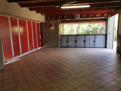 a large room with a large window and a tiled floor at Dai Heka Guest House in Strand