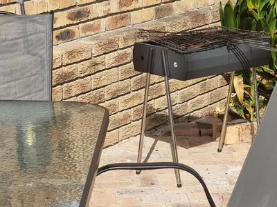 a barbecue grill sitting on top of a table at Kabana Family Home and Guest House in Cape Town