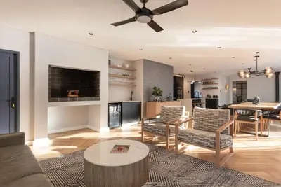 a living room with a couch and a table at Villa Paradys - Serviced in Stellenbosch