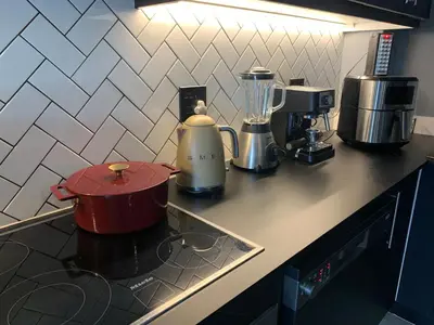 a kitchen counter with a blender on a stove at Sitari County Estate - The Most Iconic Estate in Cape Town