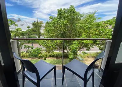 a balcony with two chairs and a view at Studio 23 @ Huis Piron. The Heart of Stellenbosch. in Stellenbosch