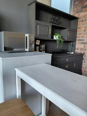 a kitchen with a white counter and a microwave at Chapman View Studio in Cape Town