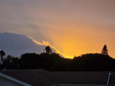 a sunset from the roof of a house at 5 AntiP in Cape Town