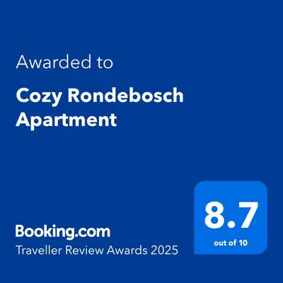 a screenshot of a cell phone with the text awarded to cozy roukeredbush experiment at Cozy Rondebosch Apartment in Cape Town