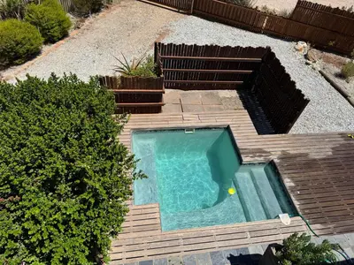an overhead view of a swimming pool in a backyard at Die Steenhuisie in Pringle Bay