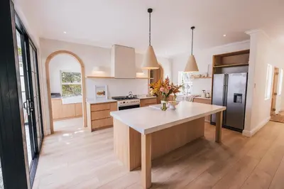 a kitchen with a large island in the middle at Menuha Hermanus in Hermanus