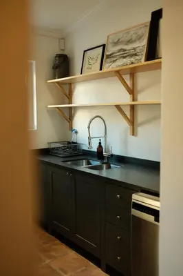 a kitchen with a sink and a counter at Gabriëlskloof Farm House in Botrivier