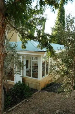 a small house with a blue roof at Gabriëlskloof Farm House in Botrivier