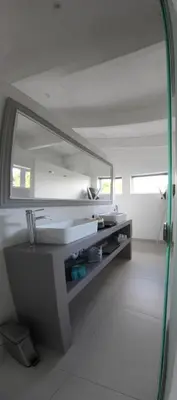 a bathroom with a sink and a mirror at 116m² SeaView TopLuxury Apart, Bay & Mountain View in Somerset West
